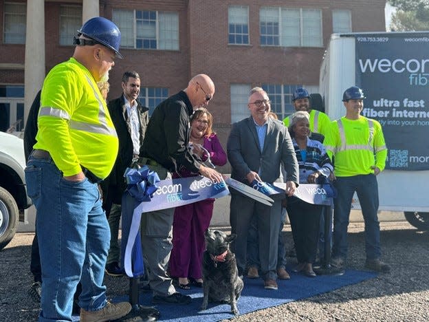 Pinal County Supervisor Jeff Serdy, Superior Mayor Mila Besich and WeCom CEO Paul Fleming cut a ribbon at a groundbreaking for a fiber optic pilot program in Superior, Ariz., on Dec. 1, 2023.