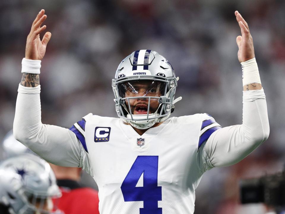 Dak Prescott of the Dallas Cowboys warms up prior to a game against the San Francisco 49ers in the NFC Wild Card Playoff game at AT&T Stadium