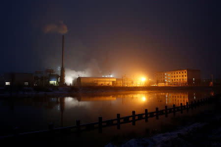 Steam and smoke rise from a factory in the Guantao Chemical Industry Park in the early morning near the villages of East Luzhuang and Nansitou, Hebei province, February 22, 2017. Picture taken February 22, 2017. REUTERS/Thomas Peter