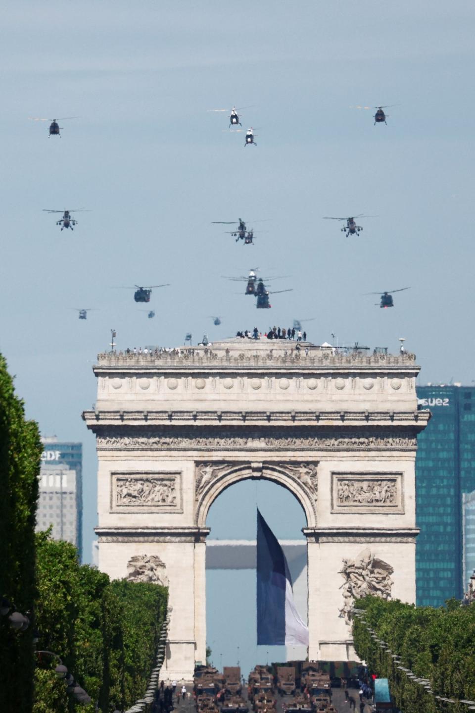 Helicopters fly over the Champs-Elysees Avenue during the annual Bastille Day military parade in Paris. (Reuters)