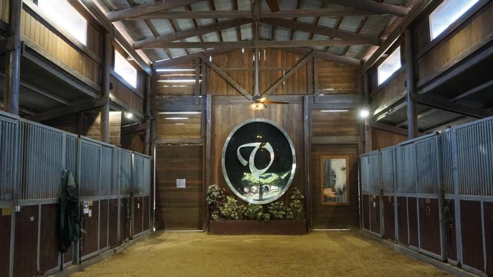 A barn at Varian Arabians Ranch stands mostly empty of its horses.