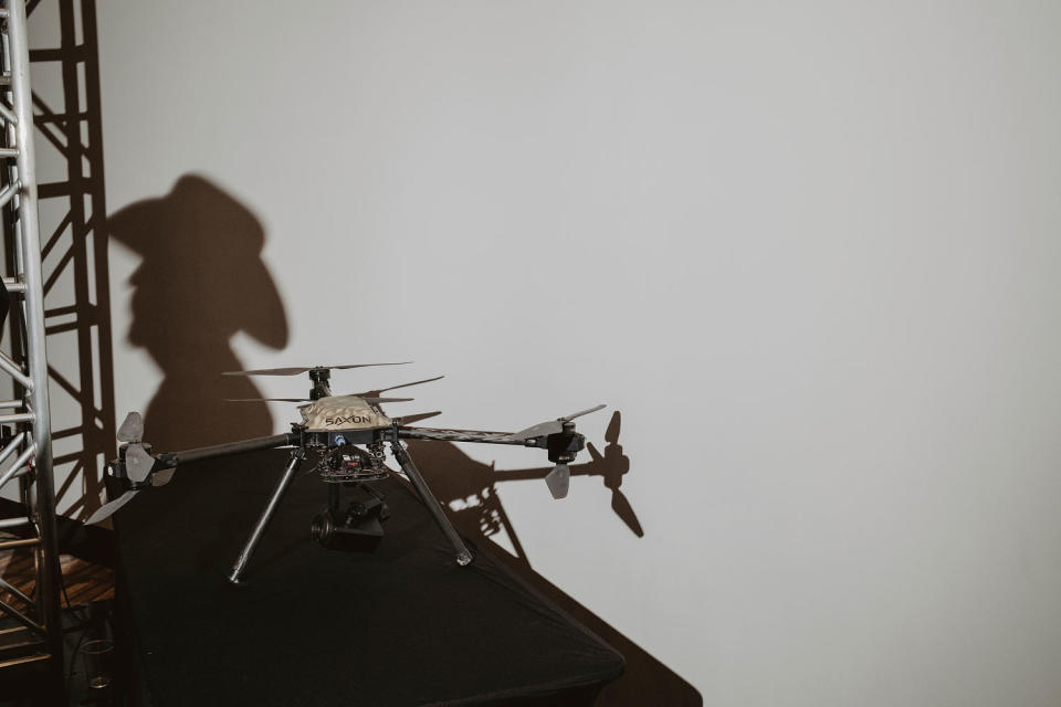A drone acts as a prop for a conspiracy-filled presentation on child trafficking. (Mark Abramson for NBC News)