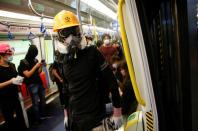 Protest at Yuen Long MTR station, the scene of an attack by suspected triad gang members a month ago, in Hong Kong