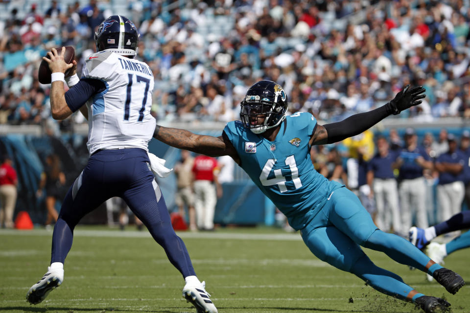 Jacksonville Jaguars outside linebacker Josh Allen (41) pressures Tennessee Titans quarterback Ryan Tannehill (17) during the first half of an NFL football game, Sunday, Oct. 10, 2021, in Jacksonville, Fla. (AP Photo/Stephen B. Morton)