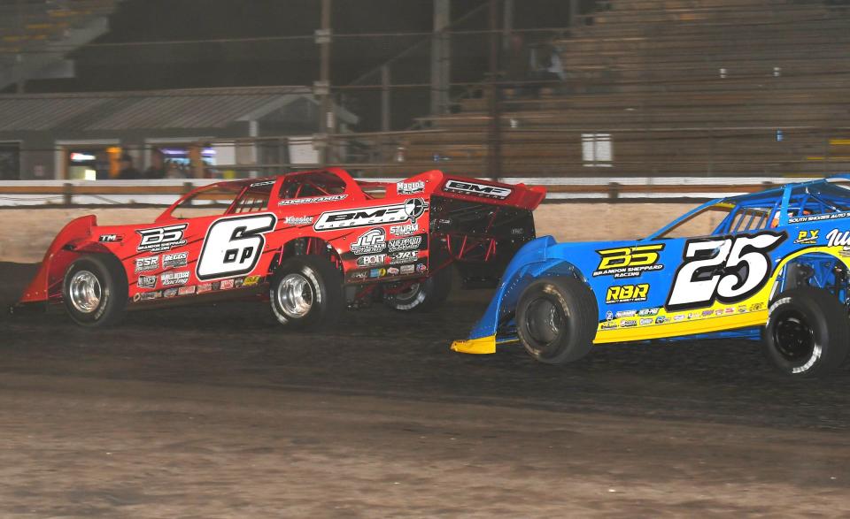 Jose Parga (6) turns back the challenge from Dakota Ewing (25) in the pro late model race.