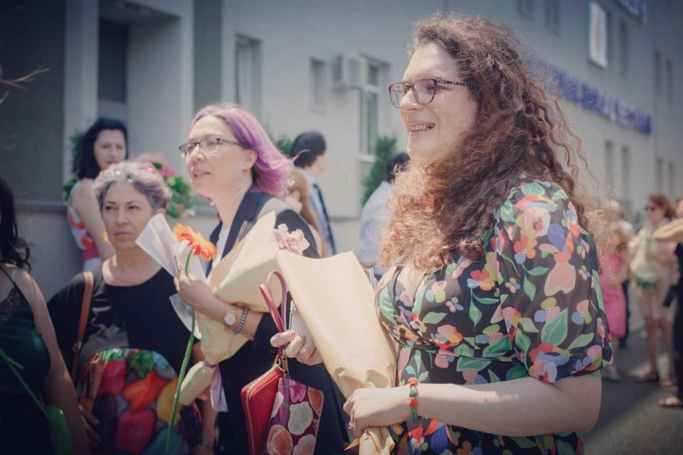 Gia (left) and Evie are seen just after getting married at a civil registry office in Bucharest, Romania, on July 9, 2022, the same day as the city's biggest ever Pride Day parade. / Credit: Courtesy of Larisa Baltă