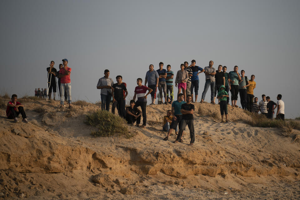 Palestinian protesters gather on the beach near the border with Israel in Beit Lahiya, northern Gaza Strip, Sunday, Sept. 2, 2018. (AP Photo/Felipe Dana)