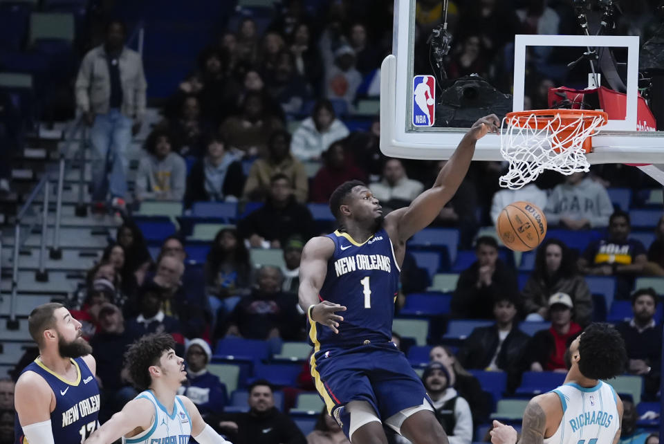New Orleans Pelicans forward Zion Williamson (1) slam dunks in the first half of an NBA basketball game against the Charlotte Hornets in New Orleans, Wednesday, Jan. 17, 2024. (AP Photo/Gerald Herbert)