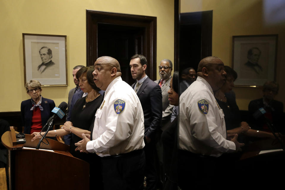 Michael Harrison, acting commissioner of the Baltimore Police Department, is reflected in a television screen as he speaks at an introductory news conference Monday, Feb. 11, 2019, in Baltimore. Harrison, the former Superintendent of the New Orleans Police Department, started Monday as acting leader weeks before the city council is expected to vote on his nomination as permanent police commissioner. (AP Photo/Patrick Semansky)