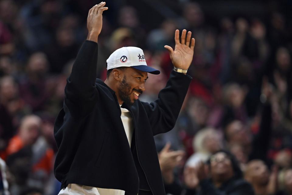 Cleveland Browns defensive end Myles Garrett reacts to cheers from the crowd in the first half of an NBA basketball game between the Cleveland Cavaliers and Denver Nuggets, Sunday, Nov. 19, 2023, in Cleveland. (AP Photo/David Dermer)