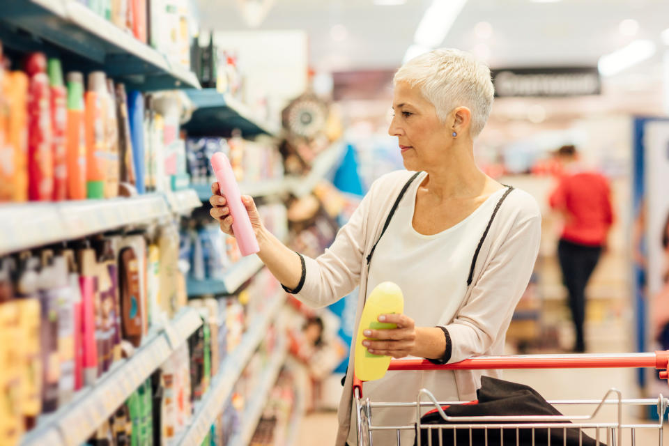 Mature smiling woman shopping in family dollar