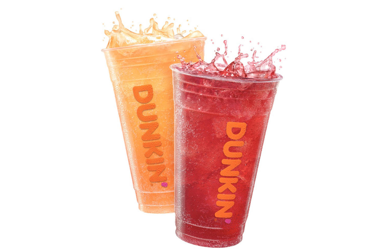 Two drinks in clear Dunkin' cups.