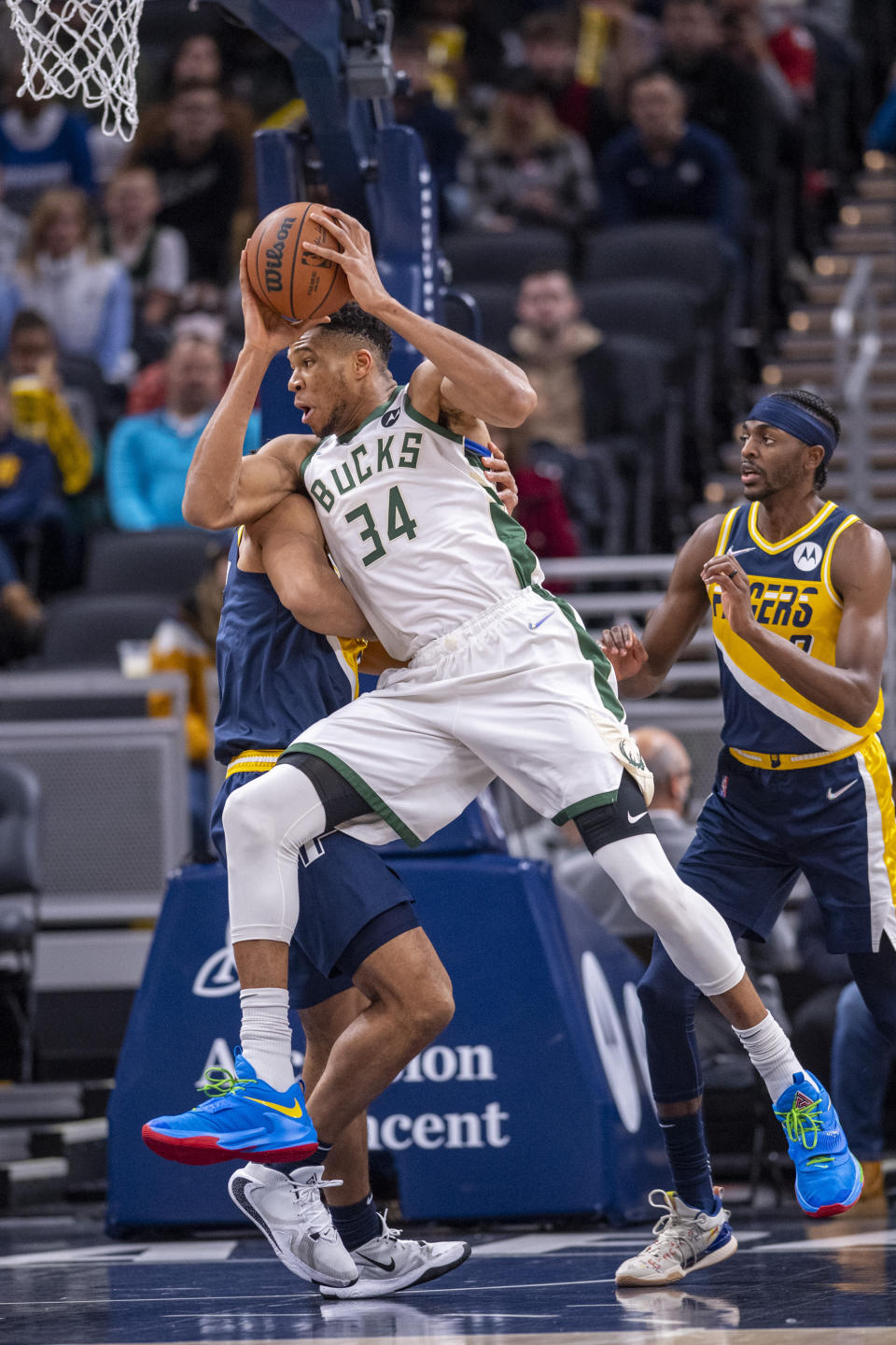 Milwaukee Bucks forward Giannis Antetokounmpo (34) drives the ball toward the basket during the first half of an NBA basketball game against the Indiana Pacers in Indianapolis, Sunday, Nov. 28, 2021. (AP Photo/Doug McSchooler)