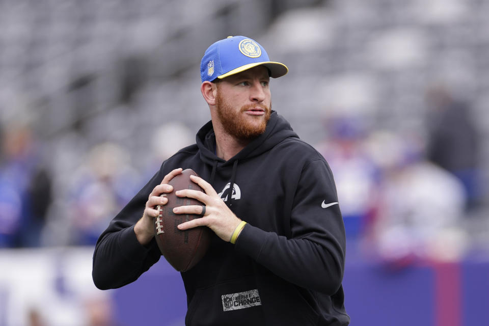 Los Angeles Rams quarterback Carson Wentz (11) practices throwing before an NFL football game against the New York Giants, Sunday, Dec. 31, 2023, in East Rutherford, N.J. (AP Photo/Adam Hunger)