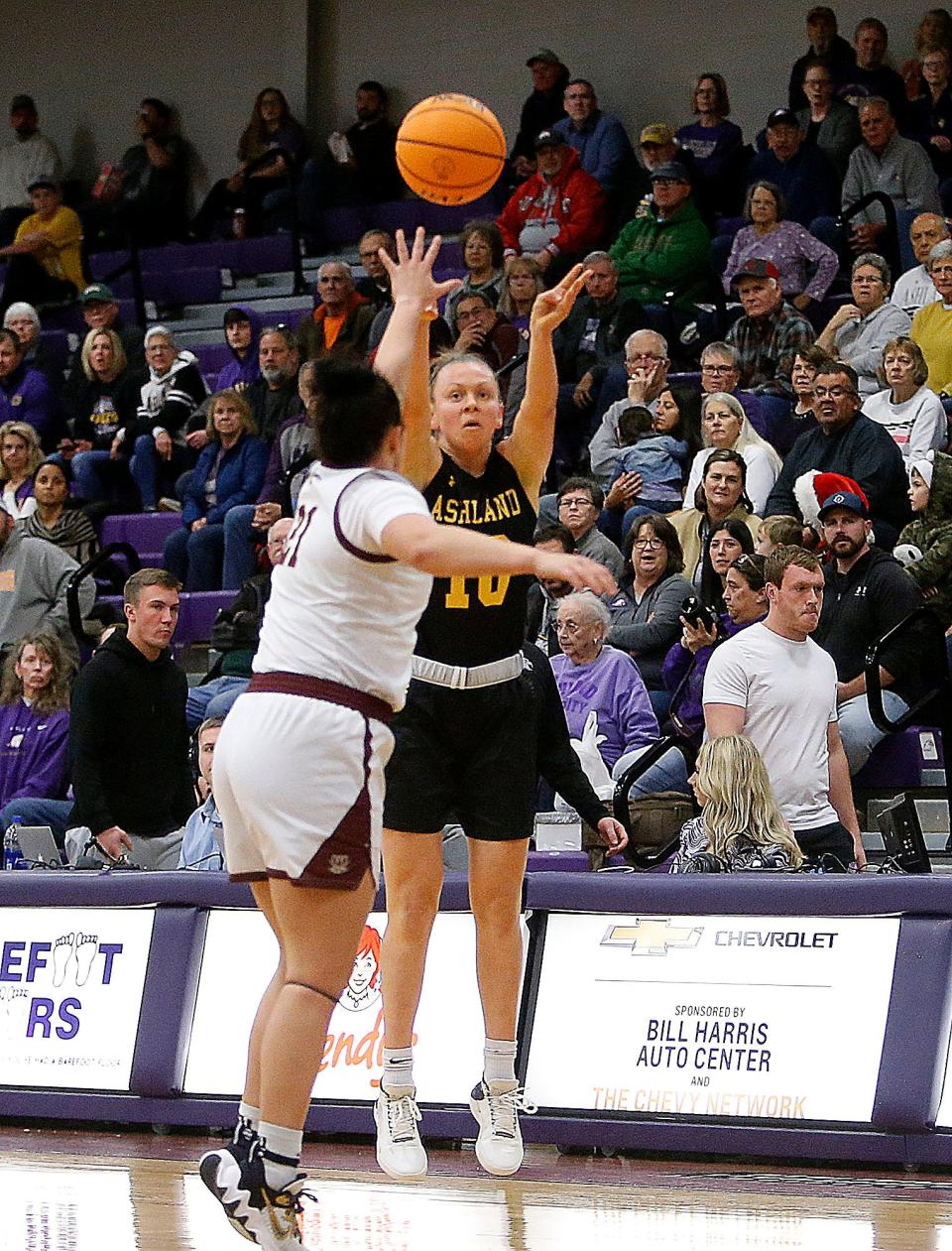 Ashland University's Hallie Heidemann (10) shoots a three pointer over Walsh University's Morgan McMillen (21) during college women's basketball action Thursday, Dec. 8, 2022 at Ashland University's Kates Gymnasium. TOM E. PUSKAR/ASHLAND TIMES-GAZETTE