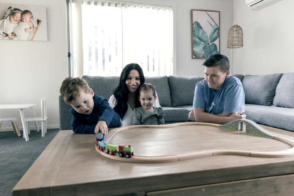 Truganina family Kayla Crea and Stacey Hope playing with their twins at their home.