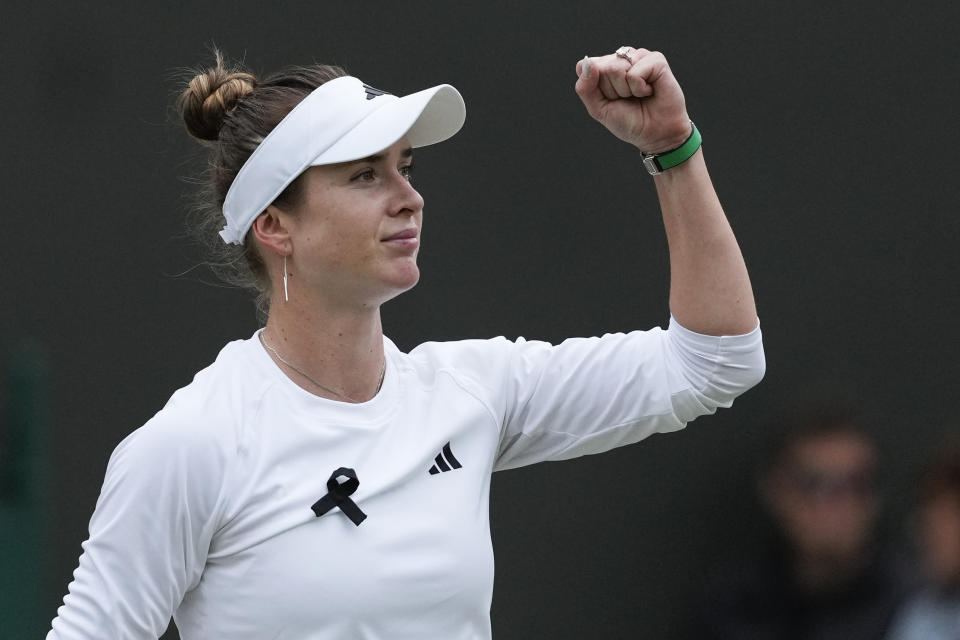 Elina Svitolina of Ukraine reacts after defeating Xinyu Wang of China in their fourth round match at the Wimbledon tennis championships in London, Monday, July 8, 2024. (AP Photo/Mosa'ab Elshamy)