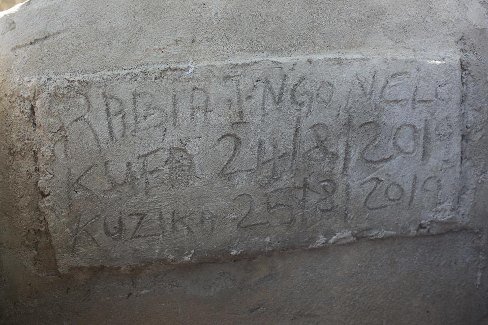 Rabia Issa's family buried her in a cemetery in Dar es Salaam, marking the grave with a simple concrete headstone.