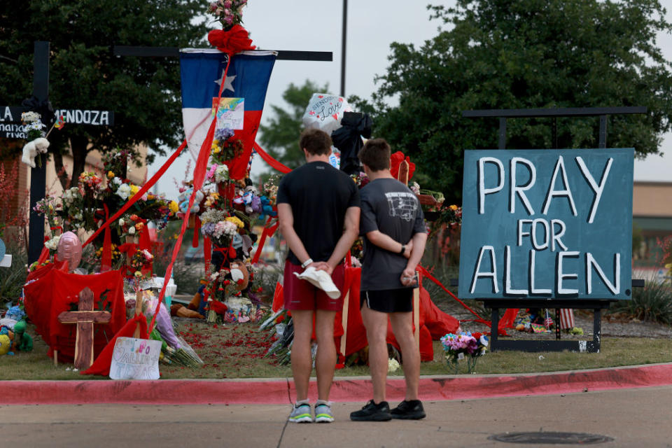 People visit the memorial near the scene of a mass shooting at the Allen Premium Outlets mall on May 9, 2023 in Allen, Texas.<span class="copyright">Joe Raedle—Getty Images</span>