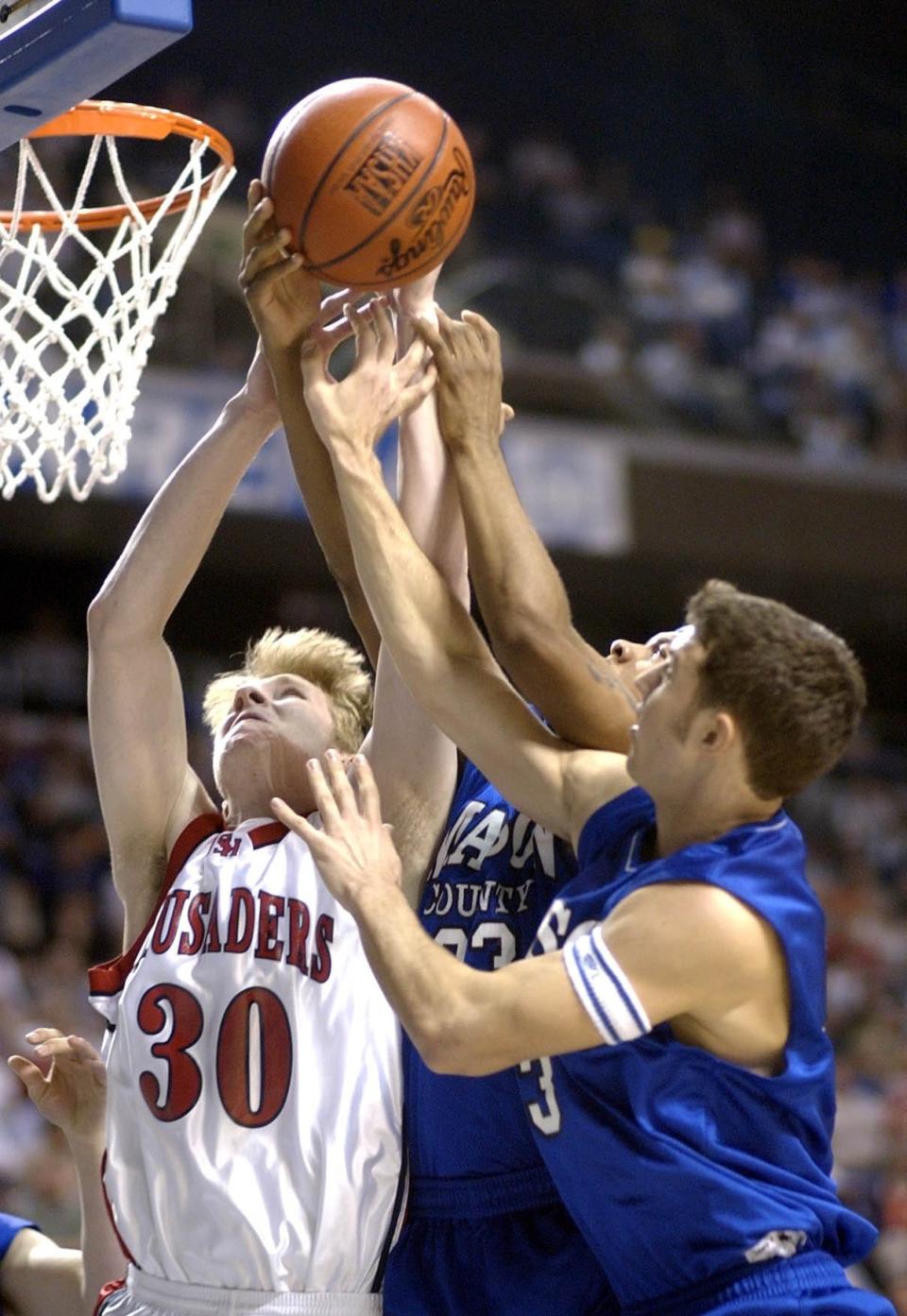 Michael Schmidt, one of St. Henry's seniors in 2003, plays during the Sweet 16 game against Mason County.