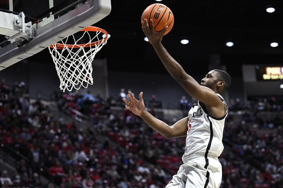 Nov 27, 2023; San Diego, California, USA; San Diego State Aztecs guard Lamont Butler (5) goes to the basket during the second half against the Point Loma Nazarene Sea Lions at Viejas Arena. Mandatory Credit: Orlando Ramirez-USA TODAY Sports