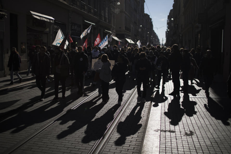 Students march during a demonstration in Marseille, southern France, Tuesday Jan. 26, 2021. Teachers and university students marched together in protests or went on strike Tuesday around France to demand more government support amid the pandemic. (AP Photo/Daniel Cole)