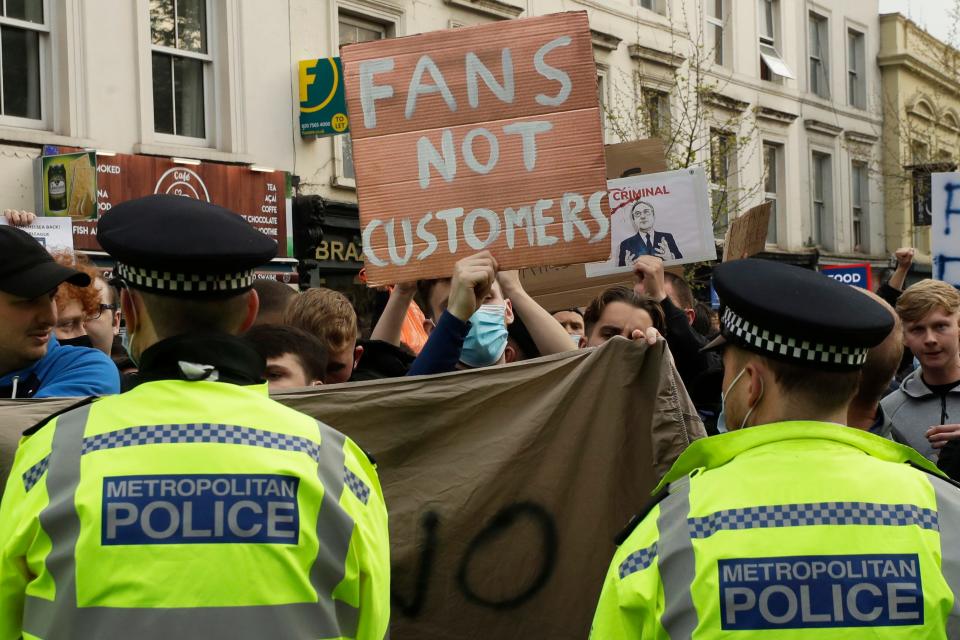 Chelsea fans protest outside Stamford Bridge stadium in London against Chelsea's decision to be included among clubs attempting to form a new European Super League.