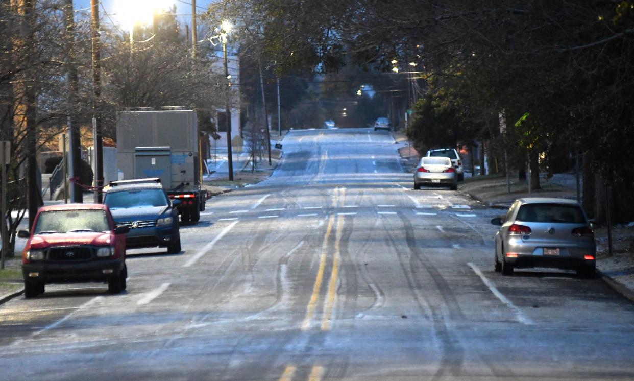 Princess St. was one of many roads in the Wilmington area covered in ice in Wilmington, N.C., Saturday Jan. 22, 2022. A wintry mix fell throughout the night over the Wilmington area and created dangerous conditions.    [MATT BORN/STARNEWS]