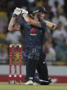 England's Ben Stokes plays a shot against West Indies during the first One Day International cricket match at the Kensington Oval in Bridgetown, Barbados, Wednesday, Feb. 20, 2019. (AP Photo/Ricardo Mazalan)