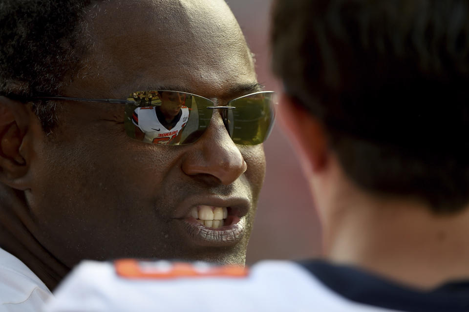 Syracuse head coach Dino Babers speaks with quarterback Tommy DeVito (13) during the second half of an NCAA college football game against Maryland, Saturday, Sept. 7, 2019, in College Park, Md. (AP Photo/Will Newton)