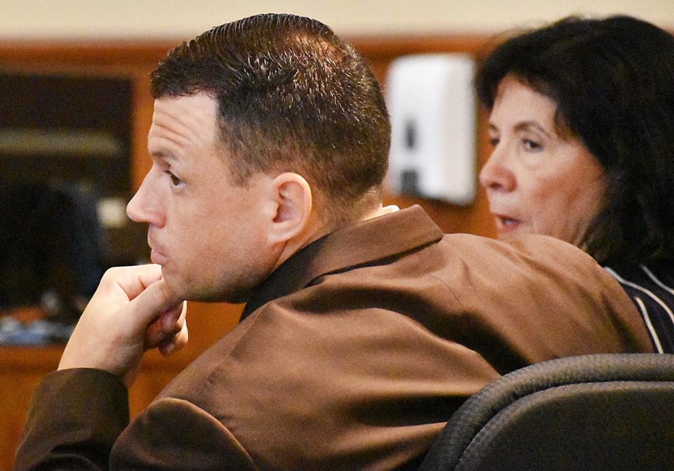 Adam Levesque listens  in court Monday.