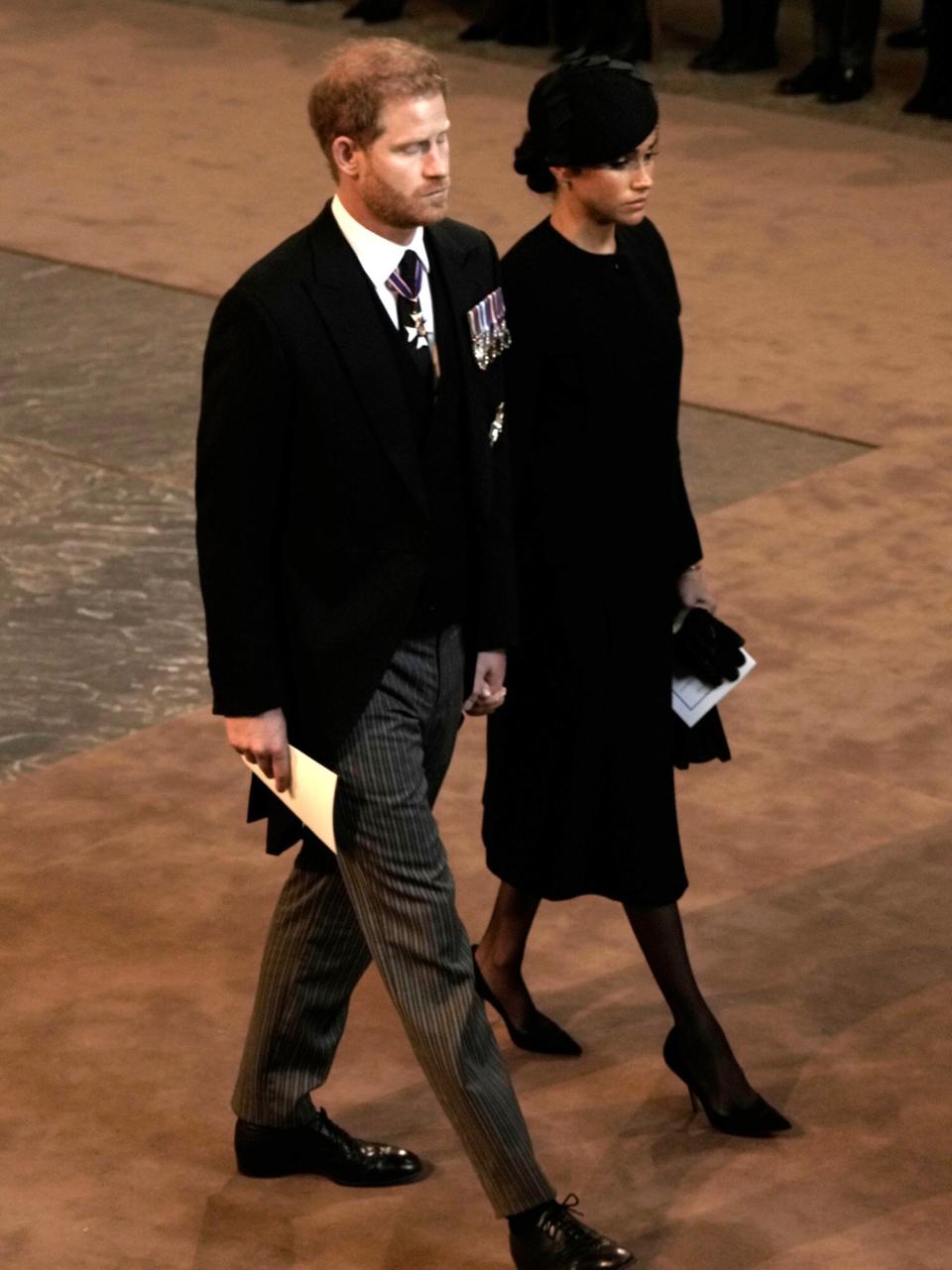 Prince Harry and Meghan, left, Duchess of Sussex, Prince William, second right, and Kate, Princess of Wales leave Westminster Hall in London