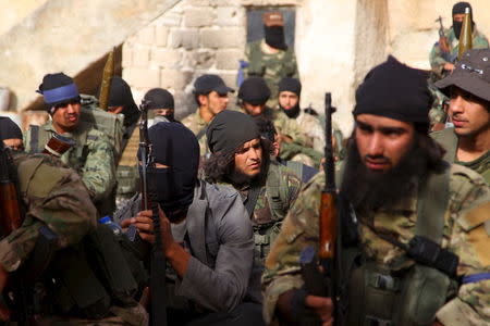 Members of al Qaeda's Nusra Front gather before moving towards their positions during an offensive to take control of the northwestern city of Ariha from forces loyal to Syria's President Bashar al-Assad, in Idlib province May 28, 2015. The Syrian army has pulled back from the northwestern city of Ariha after a coalition of insurgent groups seized the last city in Idlib province in northwestern Syria near the Turkish border that was still held by the government. REUTERS/Ammar Abdullah