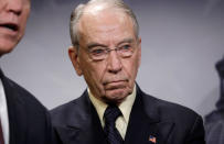 FILE PHOTO: U.S. Senate Judiciary Committee Chairman Senator Chuck Grassley (R-IA) listens as his colleagues speak during a news conference to discuss the FBI background investigation into the assault allegations against U.S. Supreme Court nominee Judge Brett Kavanaugh on Capitol Hill in Washington, U.S., October 4, 2018. REUTERS/Yuri Gripas/File Photo