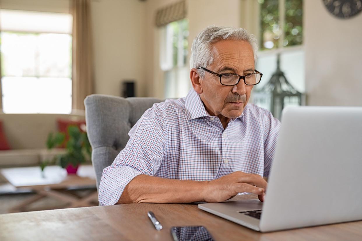 senior man looking at computer