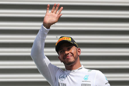 Belgium Formula One - F1 - Belgian Grand Prix 2016 - Francorchamps, Belgium - 28/8/16 - Mercedes' Lewis Hamilton of Britain waves on the podium after the Belgian F1 Grand Prix. REUTERS/Yves Herman