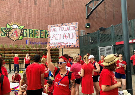 Participants take part in a march in Phoenix, Arizonia, U.S., April 26, 2018 in this picture obtained from social media. Christy Chavis/via REUTERS