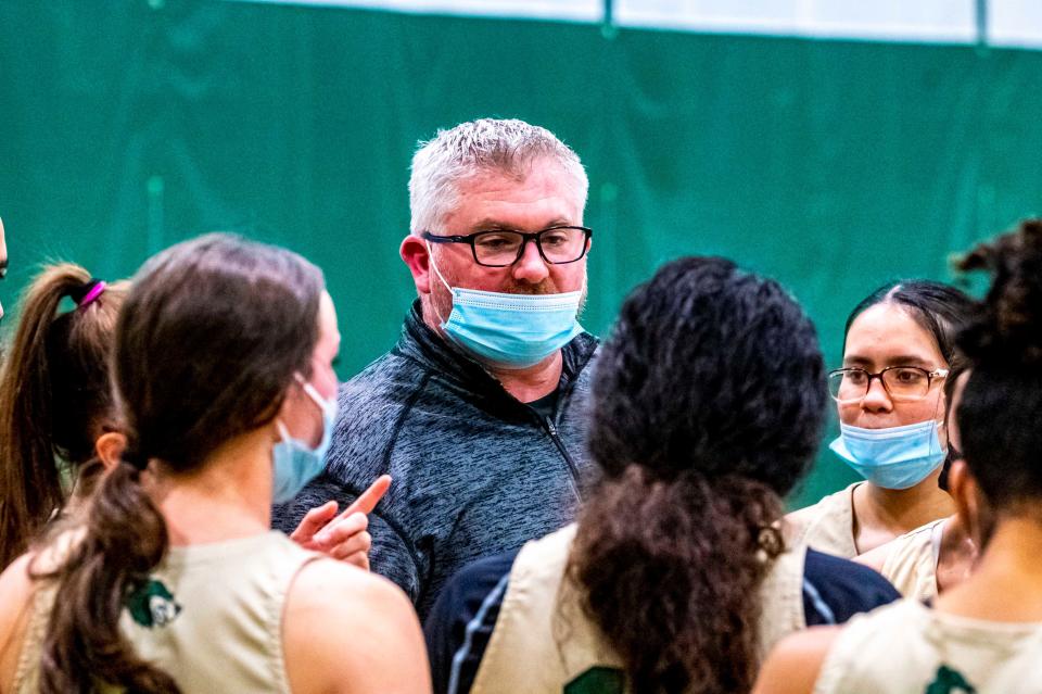 GNB Voc-Tech coach Mike Prior speaks to the team during a timeout.