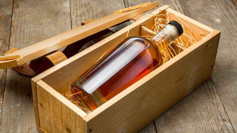 Aged whiskey in wooden crate