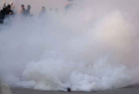 A tear gas shell fired by Indian police explodes during a protest march in Srinagar December 17, 2018. REUTERS/Danish Ismail