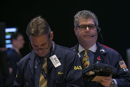 Traders work on the floor of the New York Stock Exchange September 22, 2014. REUTERS/Brendan McDermid