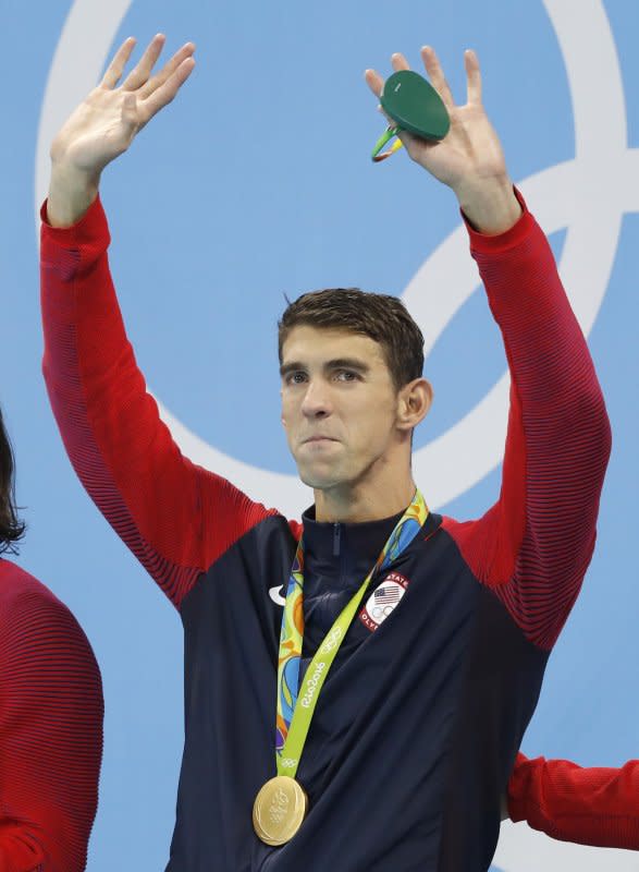 Michael Phelps celebrates winning gold after the men's 4 x 100m medley relay final at the Olympic Aquatics Stadium at the 2016 Rio Summer Olympics in Brazil on August 13, 2016. The medal was Phelps' 23rd gold, making him the most decorated Olympian in history. File Photo by Matthew Healey/UPI
