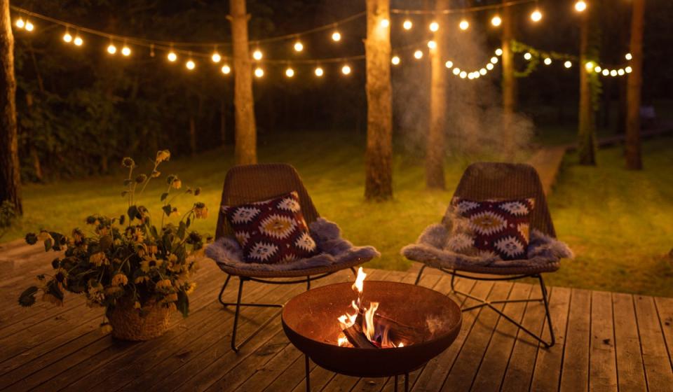 Outdoor camping with lights in the background