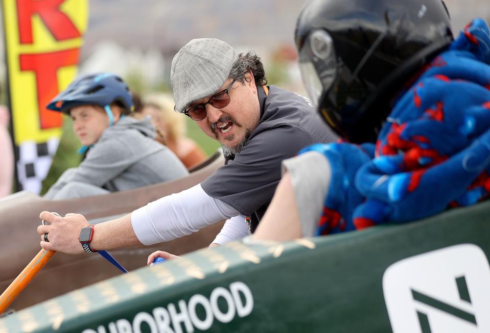Race starter Thad Weiland talks to racers before dropping the starting gate during the 3rd Annual LiveDAYBREAK Soap Box Derby in South Jordan on Saturday, May 6, 2023. | Kristin Murphy, Deseret News