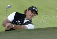 Phil Mickelson hits out of a bunker on the 7th hole during the first round of the 2016 The Masters golf tournament at Augusta National Golf Club, April 7, 2016. Mandatory Credit: Michael Madrid-USA TODAY Sports/Files