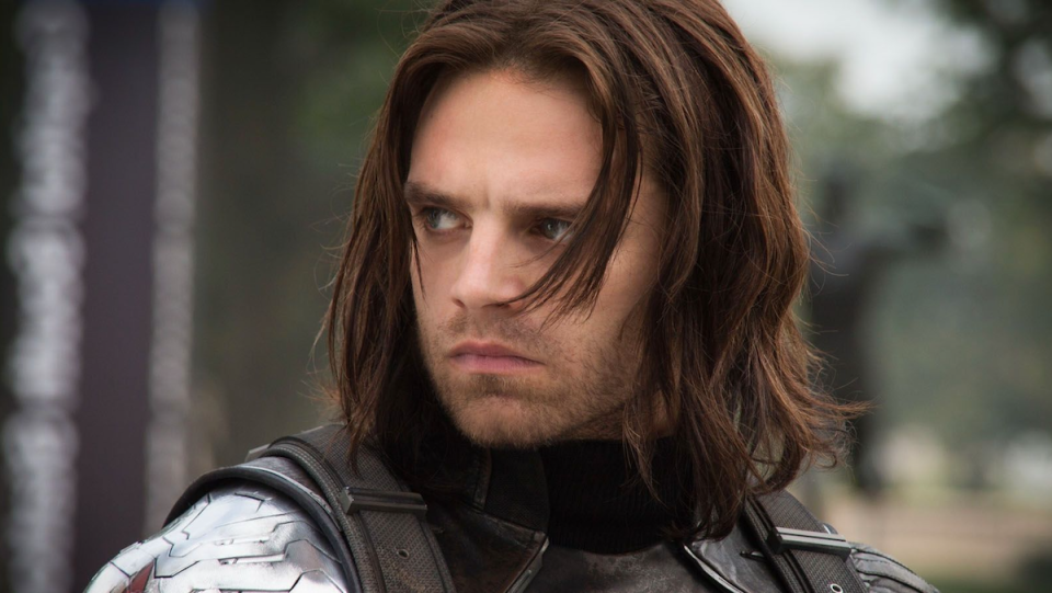 Long-haired Bucky Barnes looking pensive and filled with ennui.