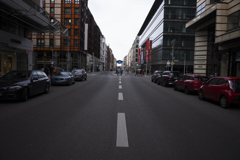 The Friedrichstrasse is almost empty in Berlin, Germany, Sunday, March 15, 2020. Berlin has closed all bars and pubs because of the coronavirus outbreak. For most people, the new coronavirus causes only mild or moderate symptoms, such as fever and cough. For some, especially older adults and people with existing health problems, it can cause more severe illness, including pneumonia. (AP Photo/Markus Schreiber)