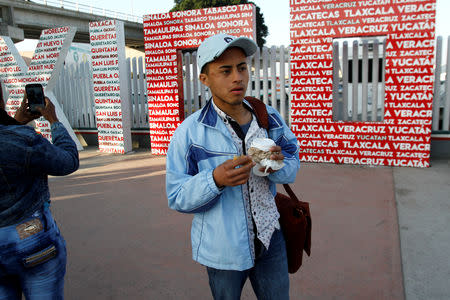 Honduran migrant Ariel, 19, who is waiting for his court hearing for asylum seekers, that have been returned to Mexico to await their legal proceedings under a new policy established by the U.S. government, have a coffee in Tijuana, Mexico, March 19, 2019. REUTERS/Jorge Duenes