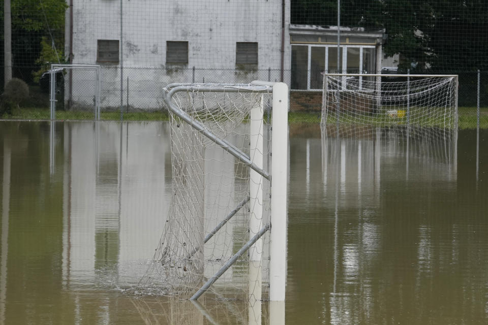 A view of a flooded soccer field in Barbiano di Cotignola, Italy, Thursday, May 18, 2023. Exceptional rains Wednesday in a drought-struck region of northern Italy swelled rivers over their banks, killing at least nine people. Rescue crews worked Thursday to reach isolated towns and villages in northern Italy that were cut off from highways, electricity and cellphone service following heavy rains and flooding, as farmers warned of "incalculable" losses and authorities began mapping out cleanup and reconstruction plans. (AP Photo/Luca Bruno)
