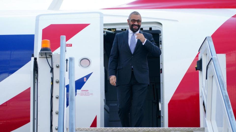 UK Home Secretary James Cleverly arrives at Kigali International Airport on 5 December, 2023